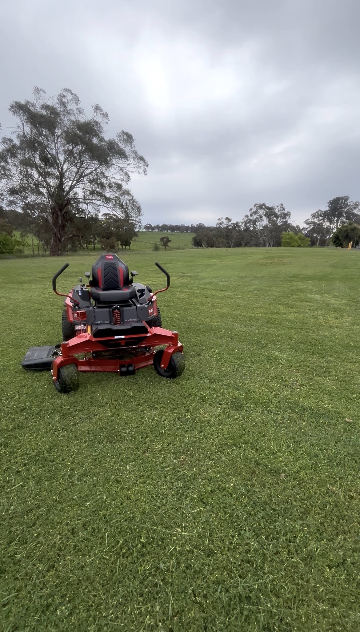 Profile Lawn Services mowing a large green lawn